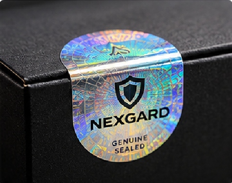 A security seal uses the holographic surface as the visible identity while the adhesive and label construction control how the seal behaves during opening.