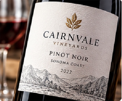 Textured papers are chosen for tactile identity on wine, spirits, fragrance, gourmet food, and gift packaging.