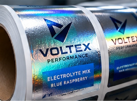 Cold foil can create metallic effects through a different transfer route from hot stamping and can suit roll-label production where material, artwork, and press economics align. It is not automatically better or cheaper.