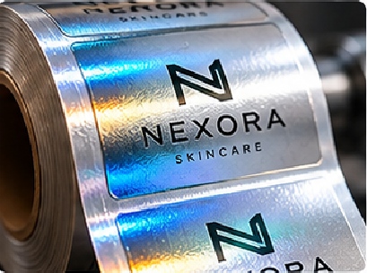 Cold foil is integrated differently from traditional hot stamping and can be suitable for broader metallic graphics or roll-production workflows depending on the design and material.