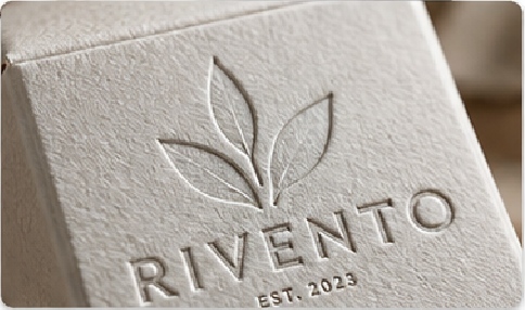 Embossing raises selected artwork while debossing presses detail into the surface. Both work best when type, logo size, material thickness and surrounding graphics leave enough room for a clean impression.